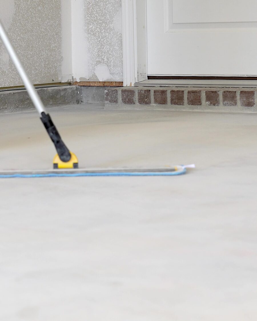 Freshly coated garage floor squeegeed out to the doorway
