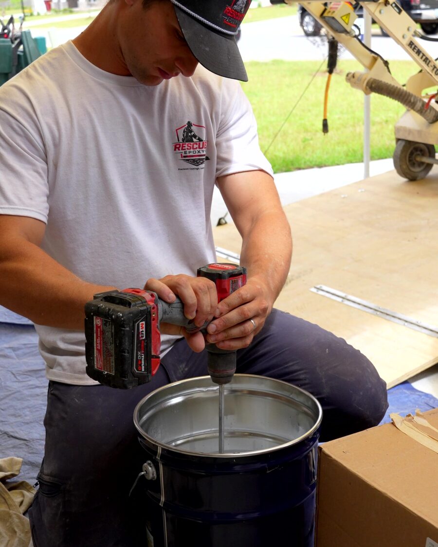 Mixing product in the driveway with the floor grinder staged behind