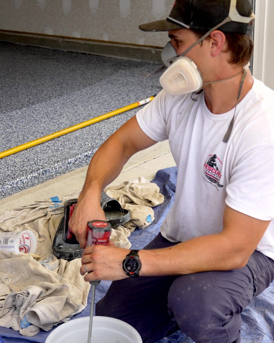Mixing on site in a respirator, drop cloths down over the slab